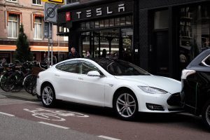 Tesla Model S in front of Tesla showroom