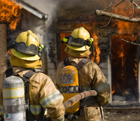 San Francisco, Ingleside Home Fire Kills One Fire fighters standing by large fire