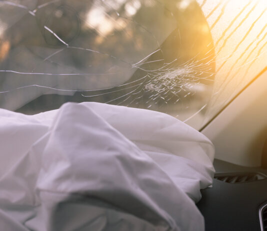 deployed and deflated airbag after truck accident