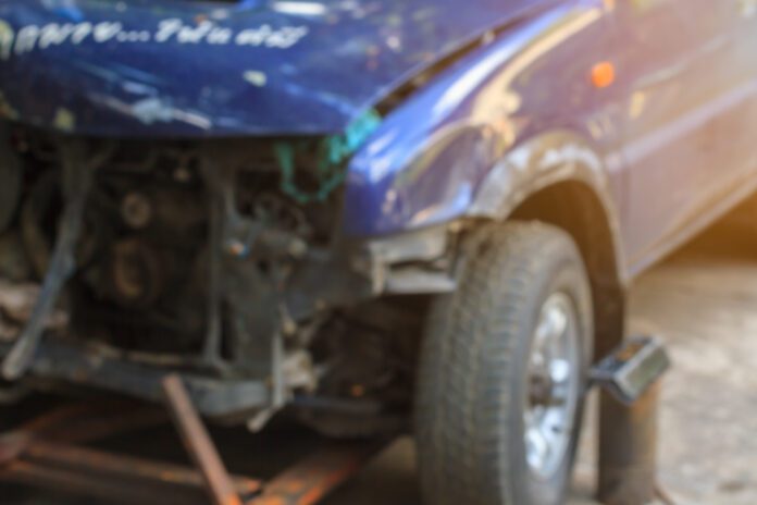 Blurred,Image,Accident,Car,,Blue,Truck,Waiting,To,Repair,After work truck collision, impact from crash