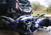 Crashed vehicle and motorcycle along the road following incident