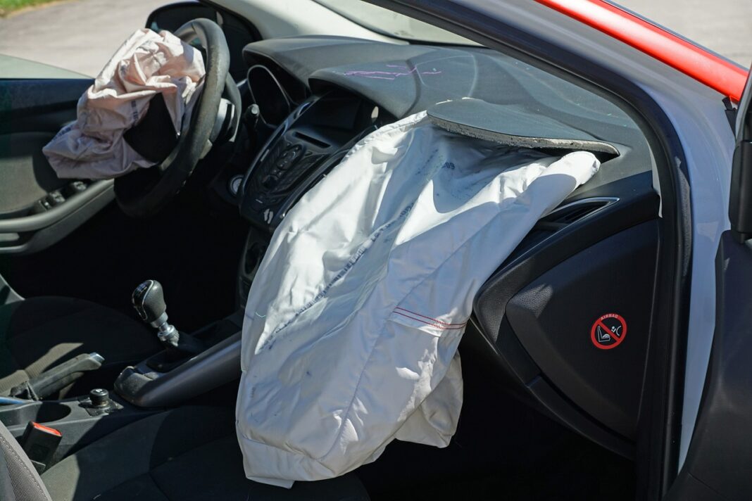 Exposed airbags depicted in vehicle after crash accident