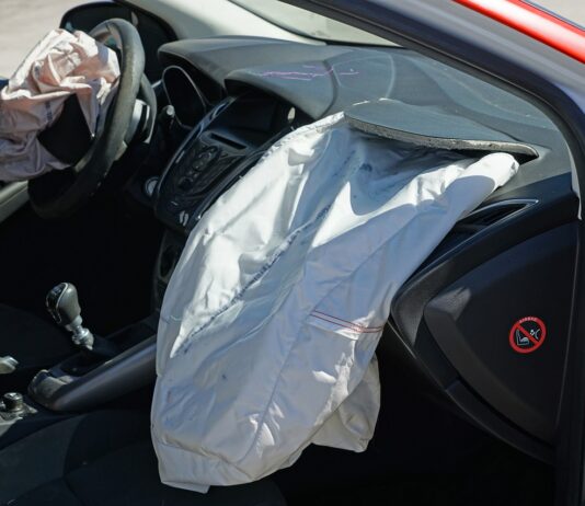 Exposed airbags depicted in vehicle after crash accident