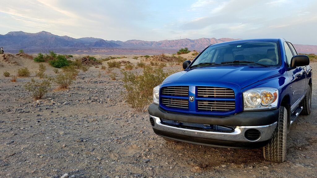 Blue Dodge Ram truck featured on road