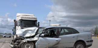 Semi truck altercation with crashed car on freeway