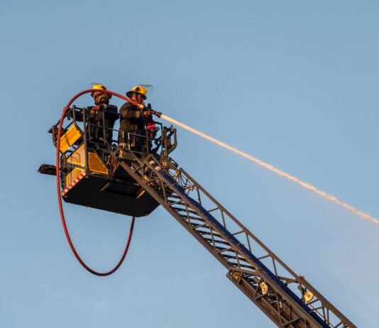 South L.A. Structure Fire Leaves 1 Man Killed Elevated fire crew extinguishing fire