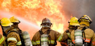Five firefighters struggle to put out structure fire