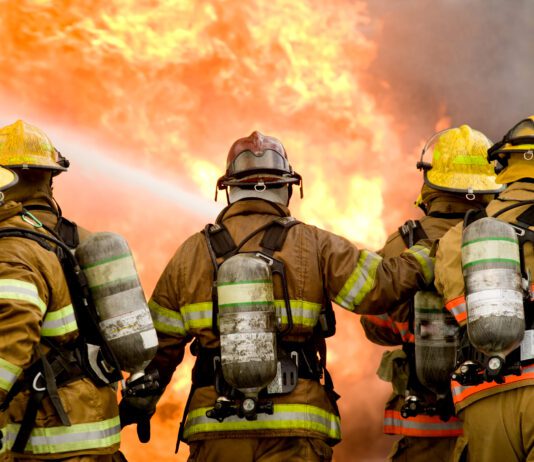 Five firefighters struggle to put out structure fire