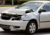 Crashed white minivan after accident