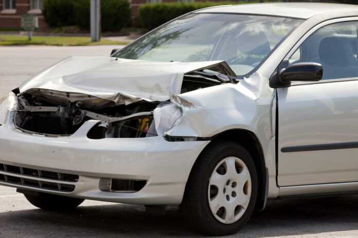 dreamstime_l_31278505 Crashed white minivan after accident