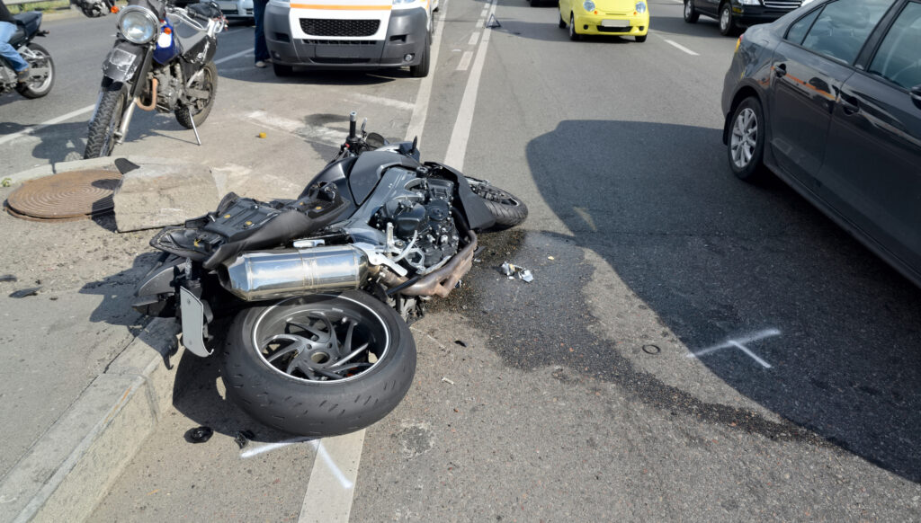 Motorcycle spread out across the road after crash