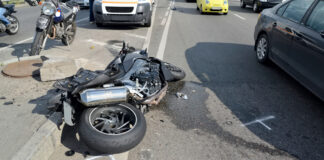 Motorcycle spread out across the road after crash