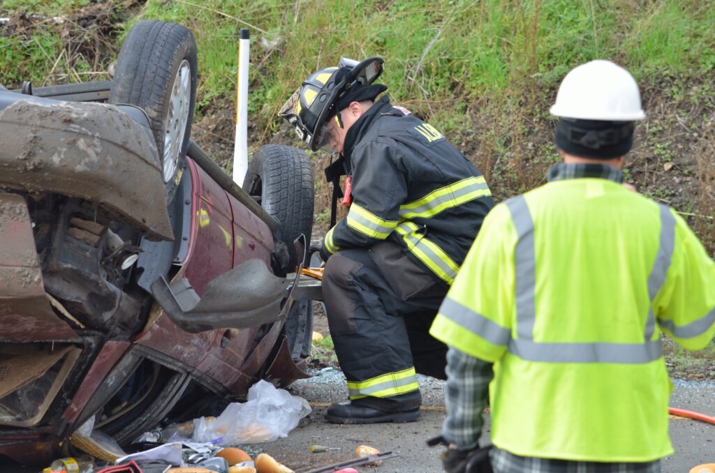 Emergency response team help victims in freeway accident crash