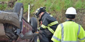 Emergency response team help victims in freeway accident crash