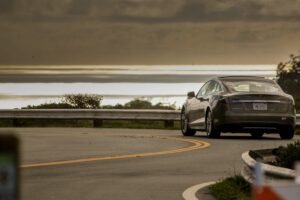 Gray Tesla driving on highway