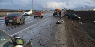 Car wrecked after highway crash off side of the road