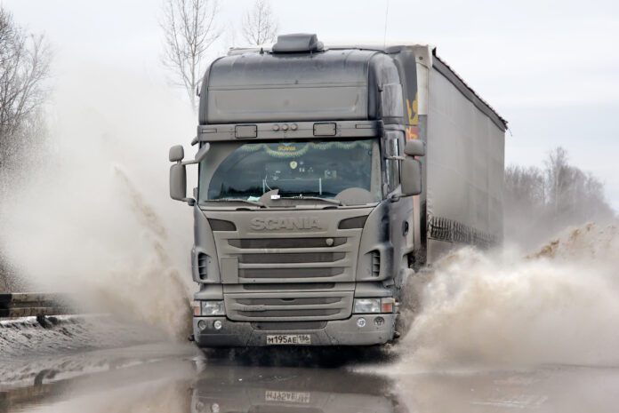 Semi trailer driving along highway