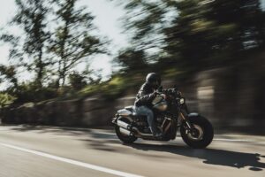 Motorcycle rider riding on road