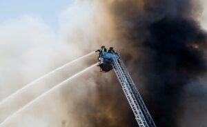 firefighters attempting to put out house fire