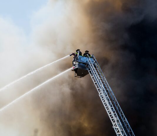 El Cajon House Fire Causes Woman Burns, Smoke Inhalation firefighters attempting to put out house fire