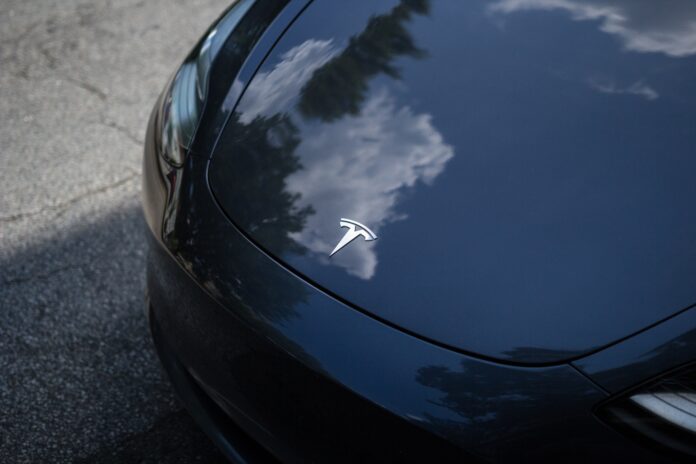 tesla Tesla depicted on highway