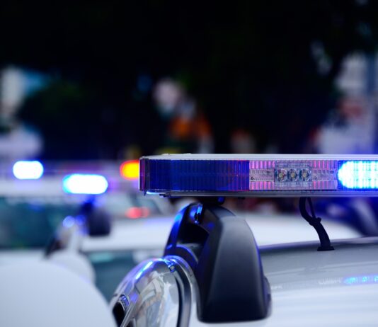 police arrive to scene of accident with their sirens flashing