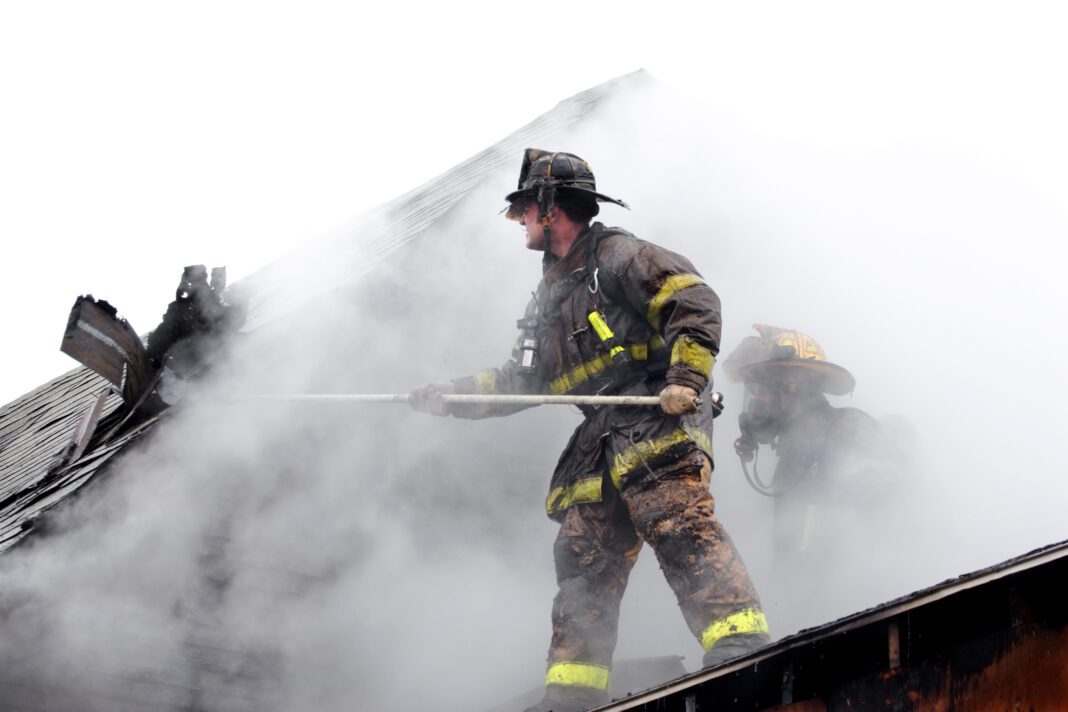 firefighters attempting to put out house fire