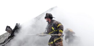 firefighters attempting to put out house fire