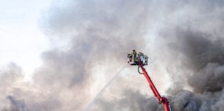 firemen putting out large house fire