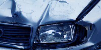 broken headlight depicted after car accident