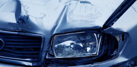 broken headlight depicted after car accident
