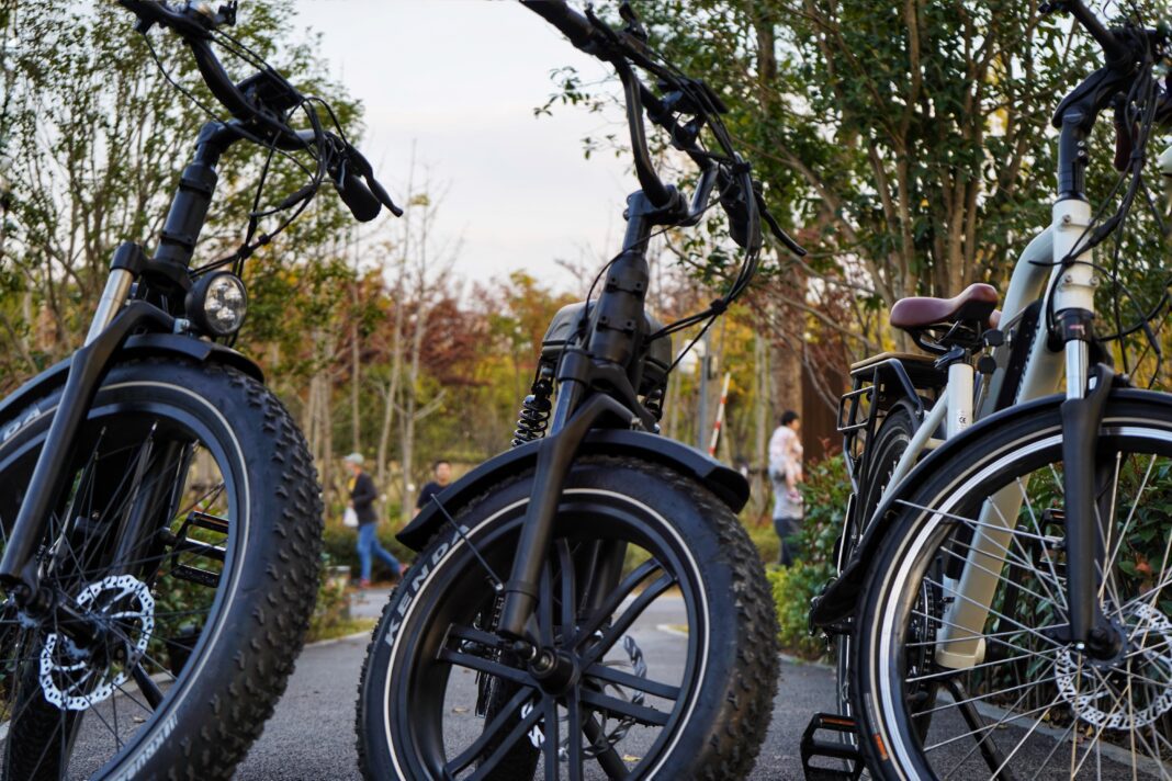 multiple e-bikes depicted on bike rack