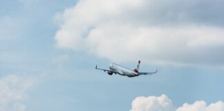airplane in flight after taking off from airport