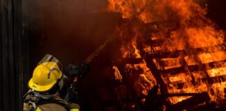 firefighters arrive to scene of house fire and attempt to put out large flames
