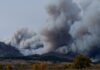 Woman Suffers Severe Burns During Rabbit Fire large wildfire smoke clouds depicted in the distance