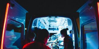 ambulance attending to victims at scene of collision