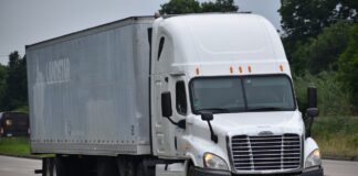 semi truck depicted driving on highway