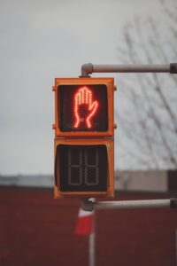 pedestrian crossing light signaling to cross road