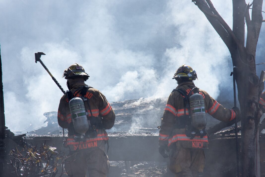 firefighters attempt to put out large fire