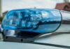 Belltown Bus Crash Kills 1 and Injures a Dozen Others police siren depicted at scene of incident