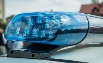 Belltown Bus Crash Kills 1 and Injures a Dozen Others police siren depicted at scene of incident