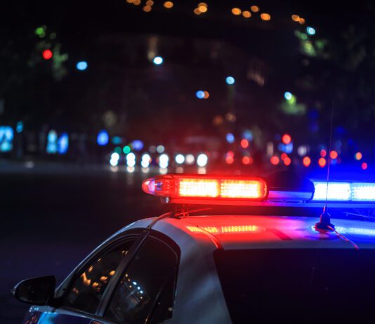 San Diego Crash Kills Motorcyclist police car depicted arriving at late night car crash