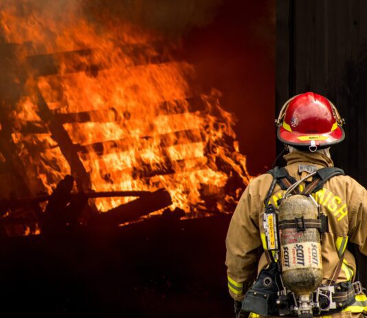 140 San Francisco Firefighters Battle Fire Near Hayes Valley firefighter attempts to put out large structural fire