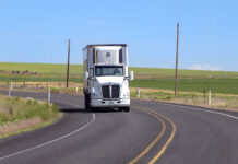 semi truck depicted driving on highway