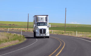 semi truck depicted driving on highway