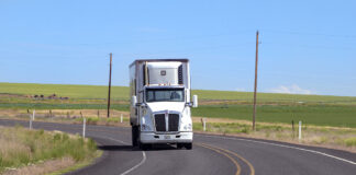 semi truck depicted driving on highway