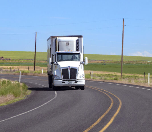 semi truck depicted driving on highway