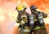 firefighters attempt to extinguish large flames