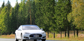 tesla depicted driving on highway