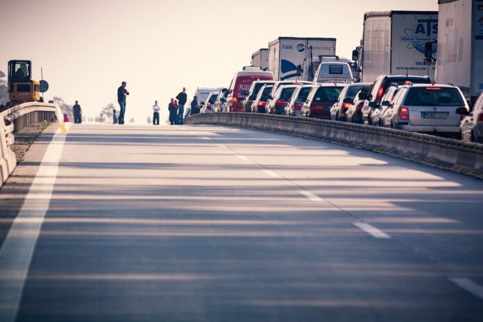 highway closure depicted with traffic backup